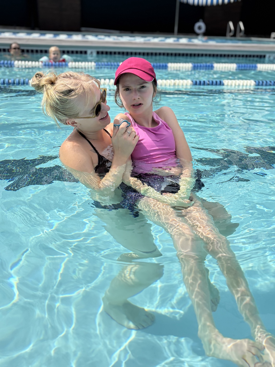 Sarah swimming with support at the Bay Club